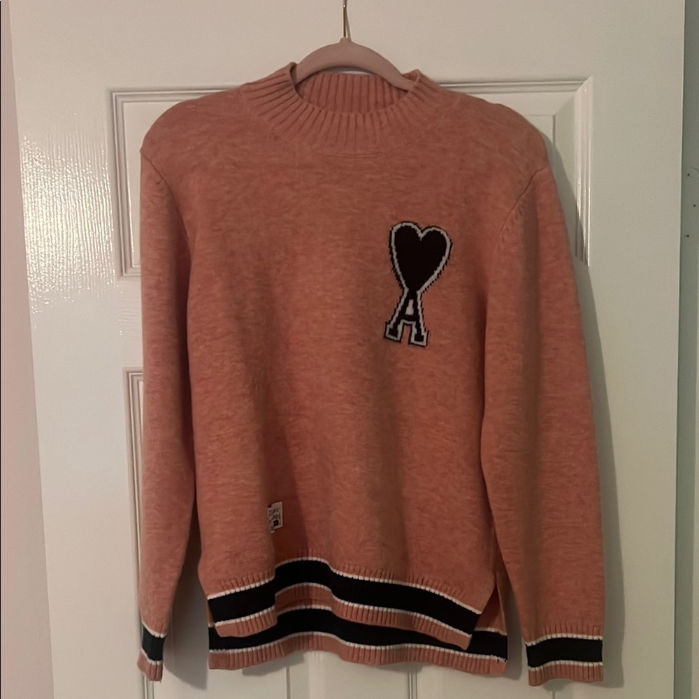 Pink Crew Neck Sweater with Graphic Design and Striped Hem